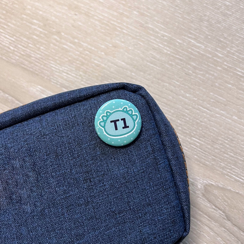 &#39;T1&#39; Printed Badge