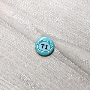 'T1' Printed Badge